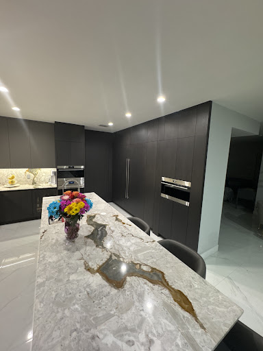 Italkraft marble island close-up with dining stools