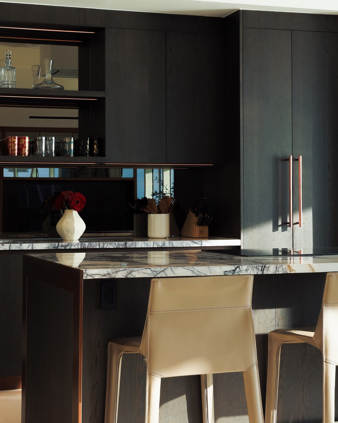 Italkraft dark oak kitchen with marble waterfall island