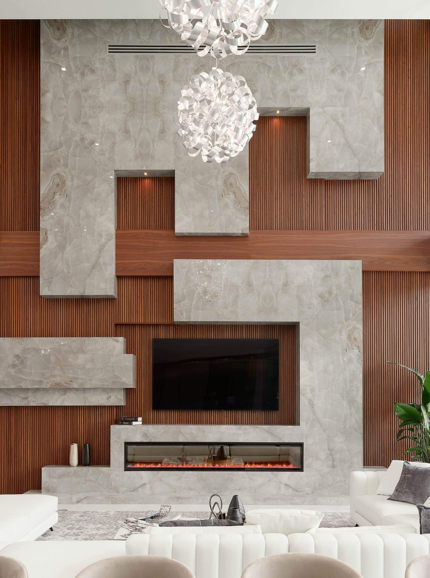 Italkraft living room with sculptural marble and walnut fireplace
