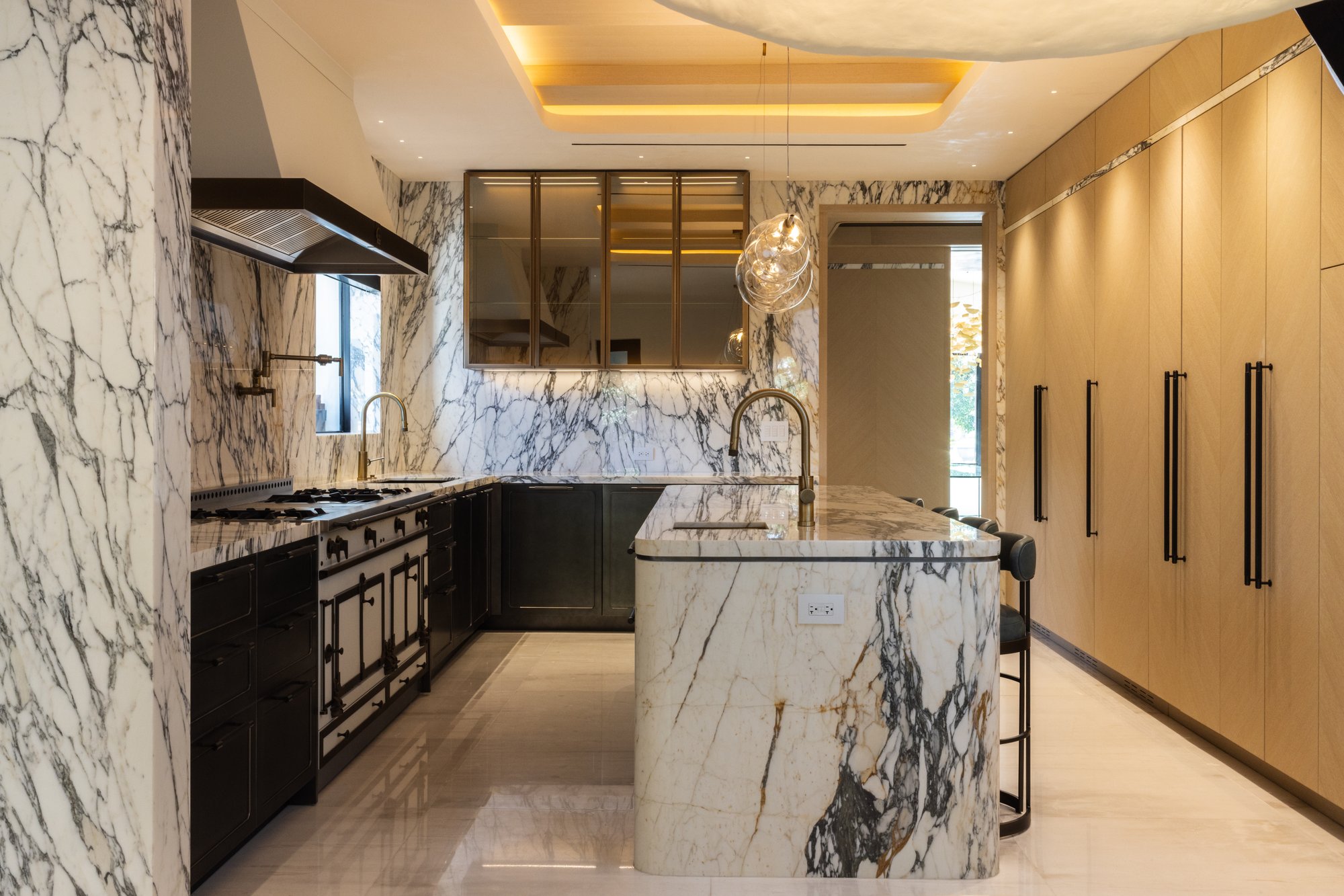 Italkraft Calacatta marble kitchen with brass detailing